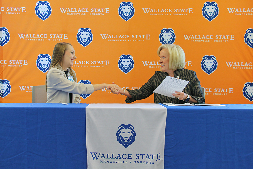 Jessica McClendon of Marshall Medical Centers shakes hands with Wallace State President Dr. Vicki Karolewics after signing the Powerful Partnerships Agreement.