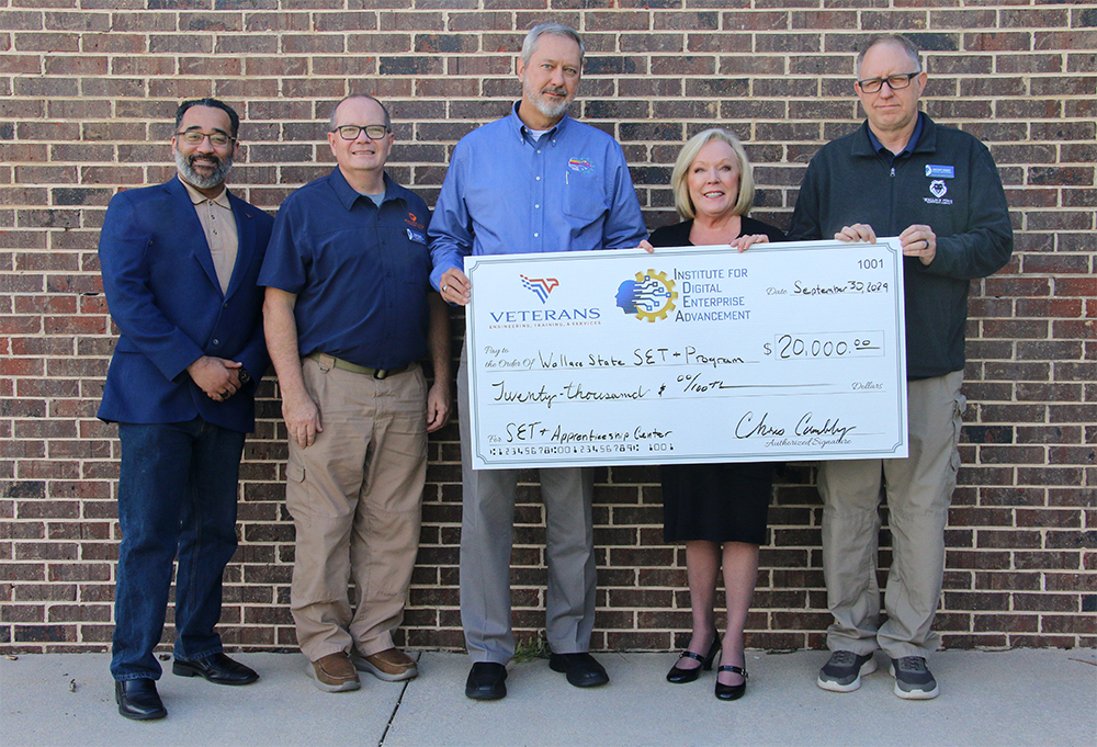 (From left to right) Deputy Director of Training for Veterans, Engineering, Training and Software (VETS) Vernon James, Wallace State Computer Science Department Chair Terry Ayers, Executive Director of the Institute for Digital Enterprise Advancement (IDEA) Chris Crumbly, Wallace State President Dr. Vicki Karolewics and Wallace State Computer Science Instructor Greg Knight.